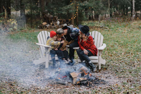 couple kissing. lovers tenderness steam white on path the forest romance stylish passionate by the campfire in the forest picnic fire romanceの写真素材