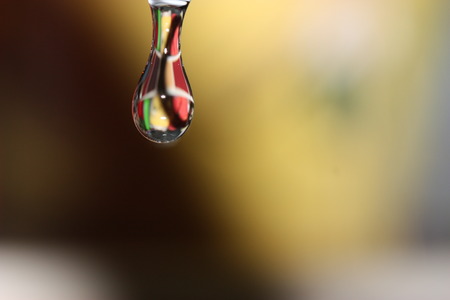 Water droplet with reflection of kitchen tilesの写真素材