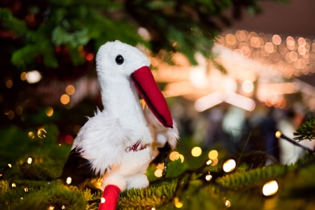 Christmas card with white stork on a new year treeの写真素材
