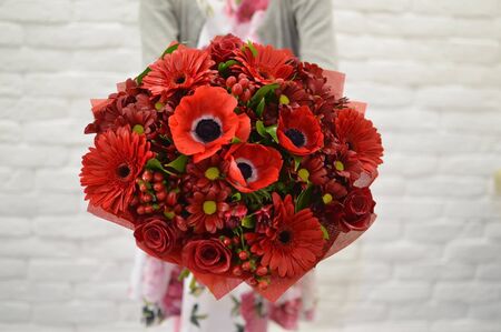 Girl with exotic flowersの写真素材