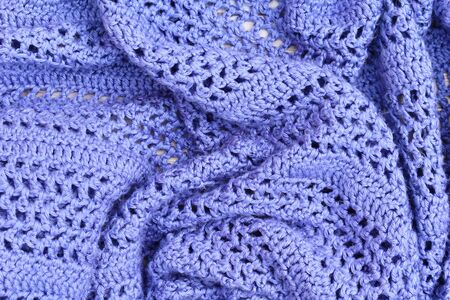 Blue knitted beautiful plaid in the fresh air. Fall cozy landscape. Hello, Autumn.