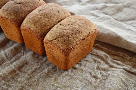 Fresh natural wheat bread. Homemade delicious pastries. Healthy natural food concept.