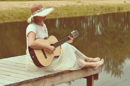Musical card with a lady in hat. Fun country vacation on  water.