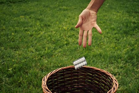 Throwing packs of drugs in the trash. Recovery and alternative medicine.の写真素材