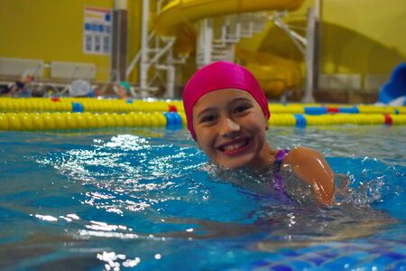 Fun children's sport in the pool. Active water sports for children.