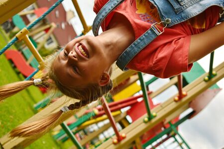 Active childrenâs outdoor activities. Happy childhood in the summer upside down.の写真素材
