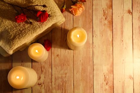 Health and body care industry. Romantic background with candles and roses. Natural therapy...