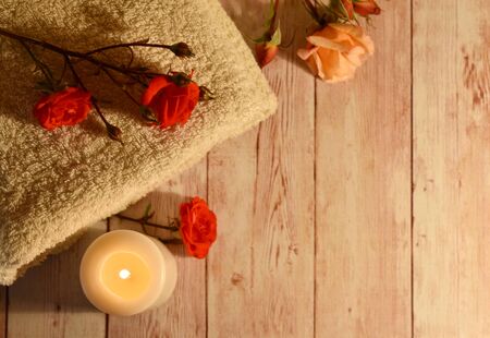 Health and body care industry. Romantic background with candles and roses. Natural therapy...