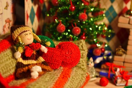 New Year's interior in miniature toy room. Cozy room for little toy doll. Handmade miniature winter accessories.の写真素材