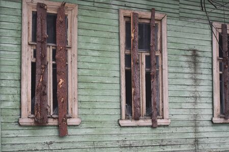Old empty gloomy house. Abandoned house with broken windows.の写真素材
