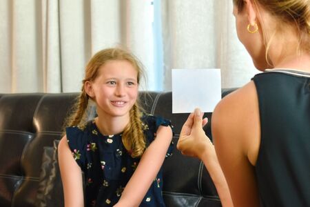 The teacher tests the child girl. The teacher and the student. The girl worried a psychologist.の写真素材