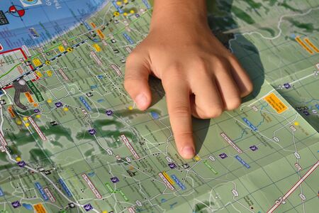 To travel around the map. People got lost. To find a place on the map.の写真素材