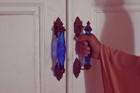 Ghost in the house. Silhouette of a man on the wall. Scary house inside.の写真素材