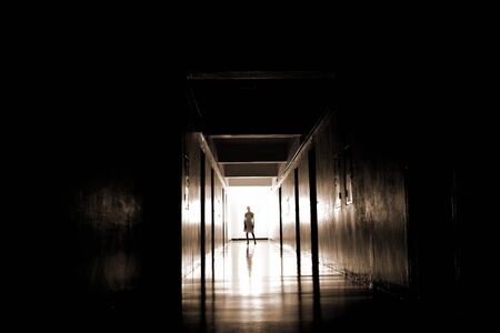 Kids shower in the corridor. The light from the end of the tunnel. The house is haunted. The world of the dead.の写真素材
