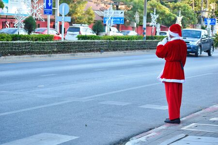 Police officer Santa Claus in Thailand. Santa Claus regulate traffic. New year at sea.のeditorial素材