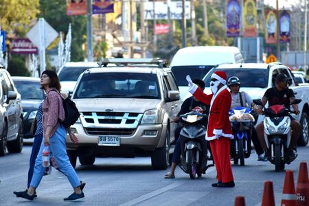 Police officer Santa Claus in Thailand. Santa Claus regulate traffic. New year at sea.のeditorial素材