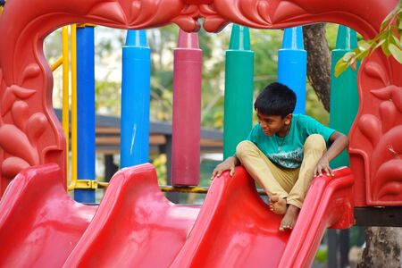 The child on the Playground. The child is involved in sports autdoor. Healthy happy boy in the...