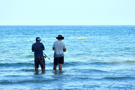 Fishermen in the seaside resort. Fish in the oceanのeditorial素材