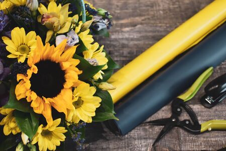 Floral bouquets on the table. Floral background. Tools of the florist.の写真素材
