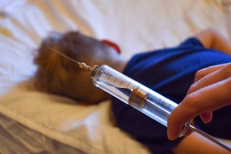 Compulsory vaccination of the population. Protecting children from the virus. Vaccination of the...