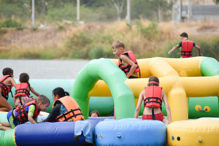 Children in the water jackets, water inflatable rides. organization of summer otdyha for children