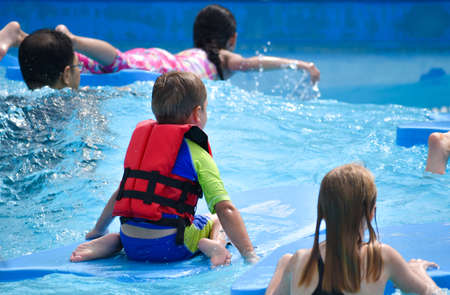 Children in the water Park in the summer. Fun active holiday in the waterのeditorial素材