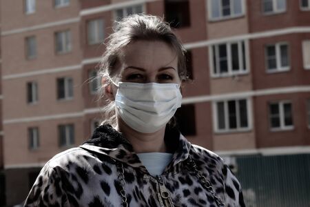 Girl infected with viruses. Take care of yourself. Stay at homeの写真素材