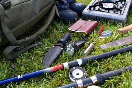 Survival in the forest. hike with a backpack in nature. Hobby men's hunting and fishing