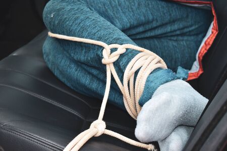 the captive child in the car. Illegal theft and ransom of a childの写真素材