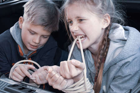 crimes with children. Victims of children in trunk of car. Illegal imprisonmentの写真素材