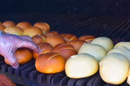 Fresh smoked cheese in a smokehouse outside. Dried delicious cheese delicacy. Caucasian national cuisineの写真素材