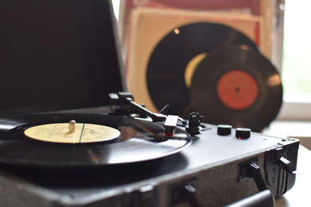 retro vinyl records for music player. vintage music gramophone. listening to old tunesのeditorial素材