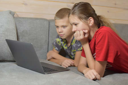 children's home schooling. happy children learn remotely at home