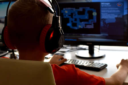 boy is playing an online game on the internet. children's gambling addiction. online learning