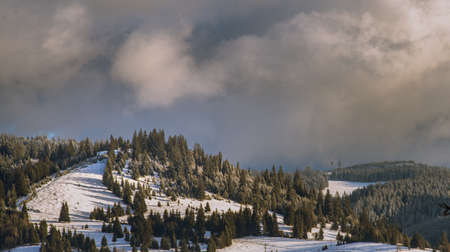 Winter, high mountains with snow white peaks.  Location place Carpathian, Vatra Dornei, Bucovina, Suceava, Romania, Europe.の写真素材