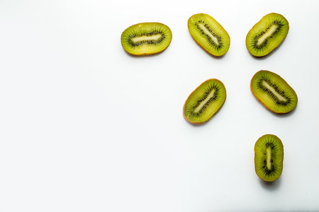 Slice of kiwi fruit isolated on white backgroundの写真素材
