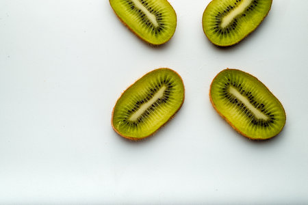 Slice of kiwi fruit isolated on white backgroundの写真素材
