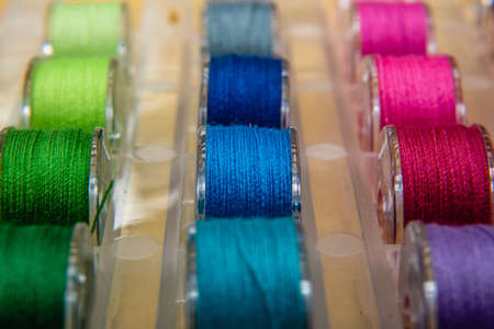 Colored thread coils , Colorful yarn on spool, yarn on tube, cotton, wool, linen threadの写真素材