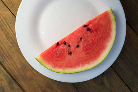 Delicious watermelon outdoors wooden table, GREEN natural background Slice sunny day, Heap, Fresh...