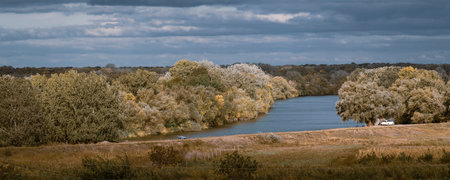 Autumn forest river stream landscape pond cloudy The bank of the Dniester Delta OlÄneÈti, Moldovaの写真素材