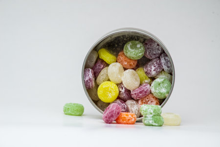 colorful sweet flavored boiled sweets, candies, Candy on white, black background, hard candyの写真素材