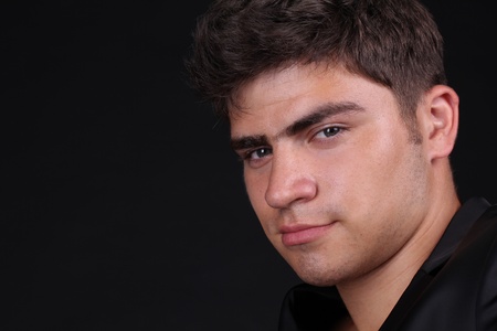 Close up face of man over darkの写真素材