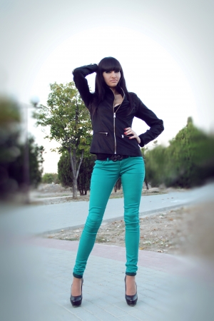 Full length portrait of confident young woman standing, outdoorsの写真素材