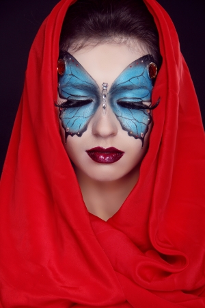 Fashion Make up. Butterfly makeup on face beautiful woman. Art Portrait.の写真素材