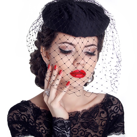 Retro woman portrait in hat isolated on white background. Makeup. Red lips and polish nails.