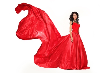 Fashion photo of young magnificent woman in red dress isolated on white background. Studio photoの写真素材