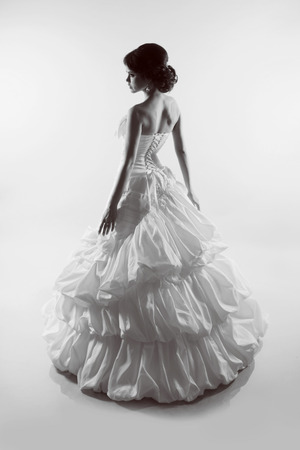 Portrait of beautiful bride in magnificent wedding dress. Black and white photoの写真素材