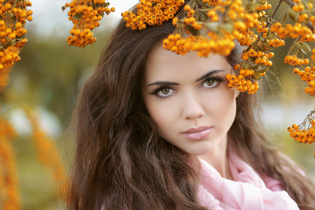 Beautiful woman autumn portrait, colorful park. Outdoor.の写真素材
