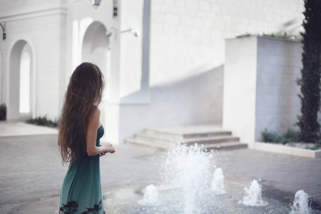 Woman tourist walking on the street, summer fashion style, travel to Tivat in Montenegro, Europe.の写真素材
