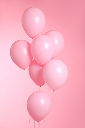 closeup of balloons isolated on pink backgroundの写真素材